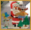Weihnachtsmann mit Elch und Schneemann
